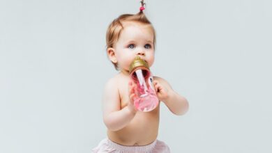 portrait beautiful baby girl toddler stay diaper with pink bottle water 496169 798